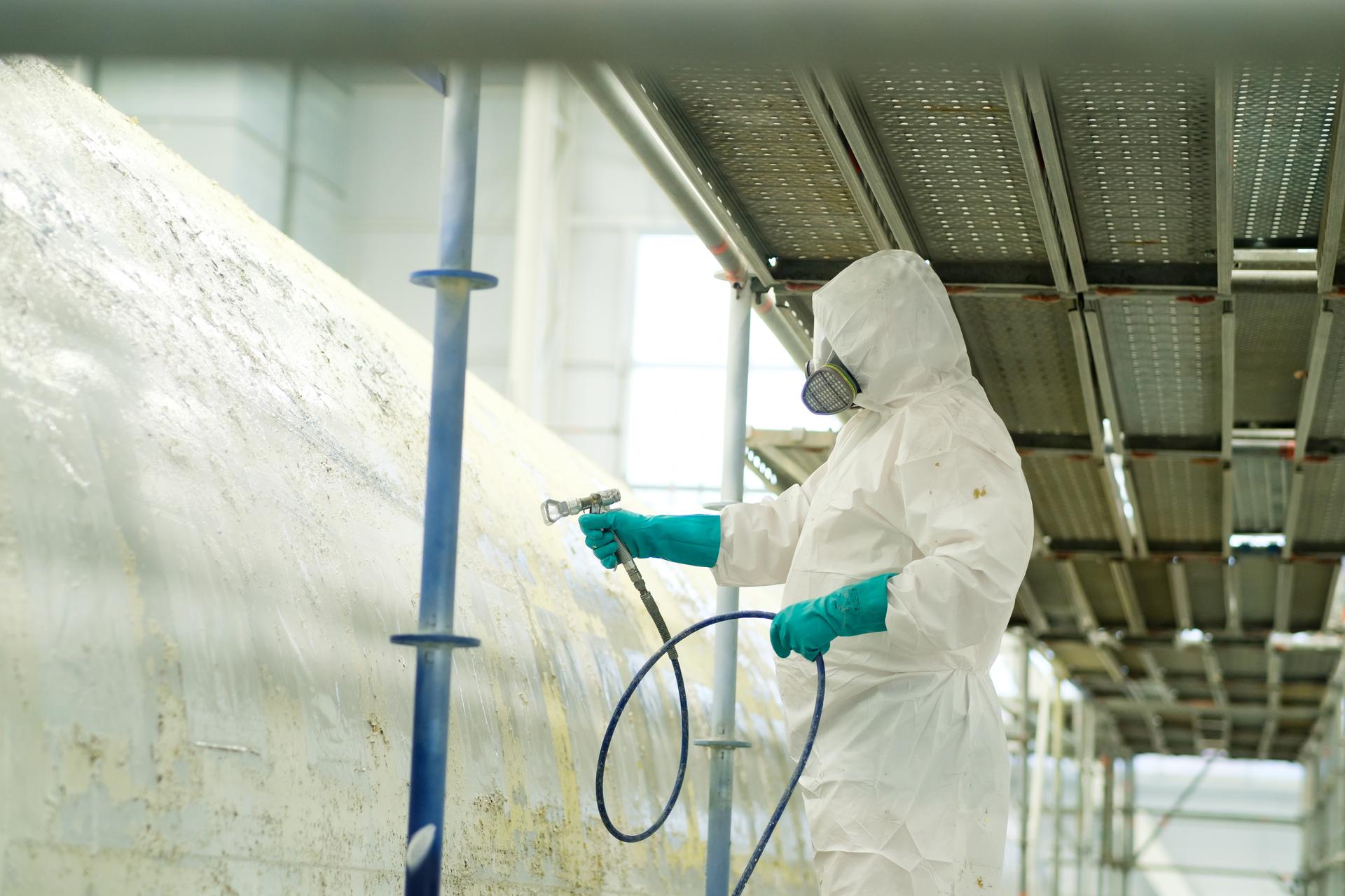 Worker Spray Painting